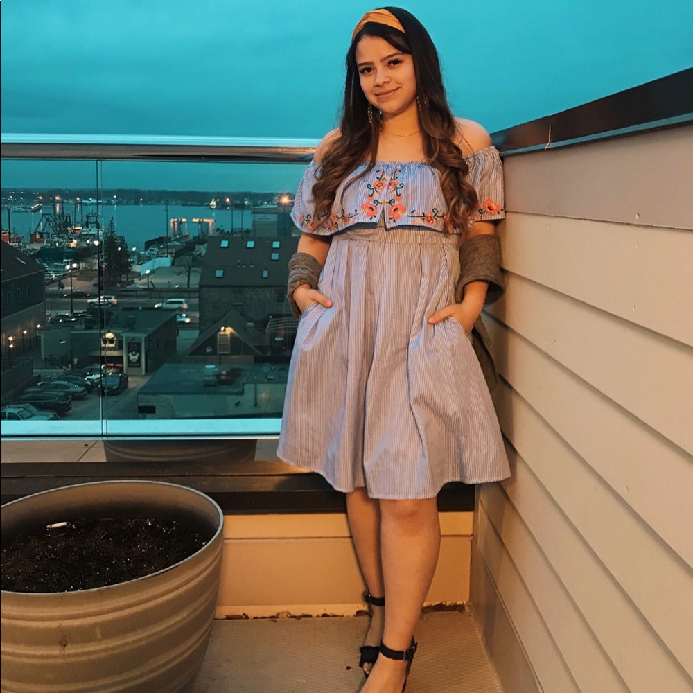 Blue striped off the shoulder dress with flowers.